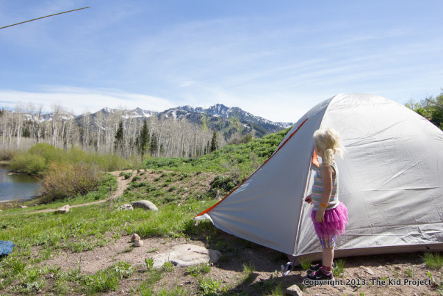 little girl backpacking with Kelty tent
